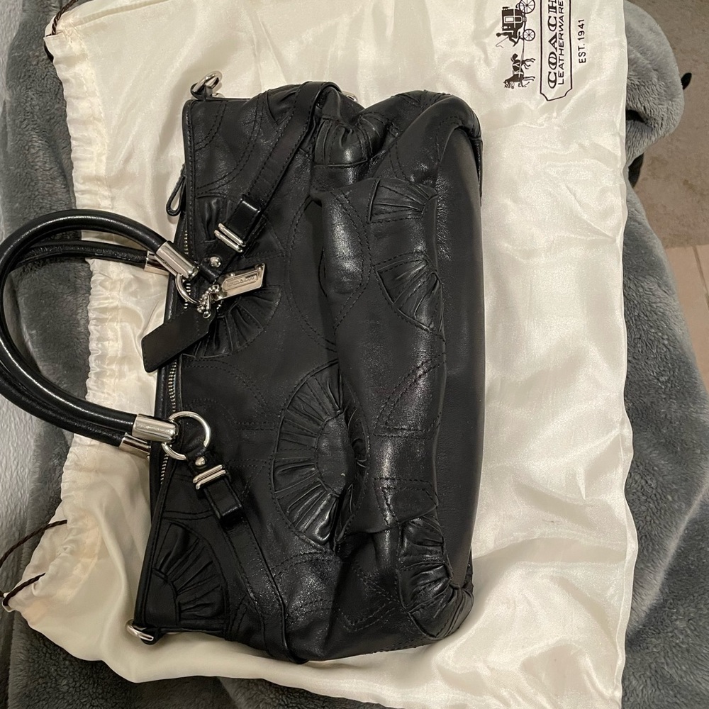 Coach women’s hand bag black leather with shoulder strap and dust bag